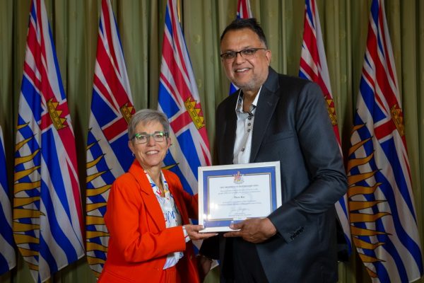 Receiving long term service for service to the province from the then minister of Finance